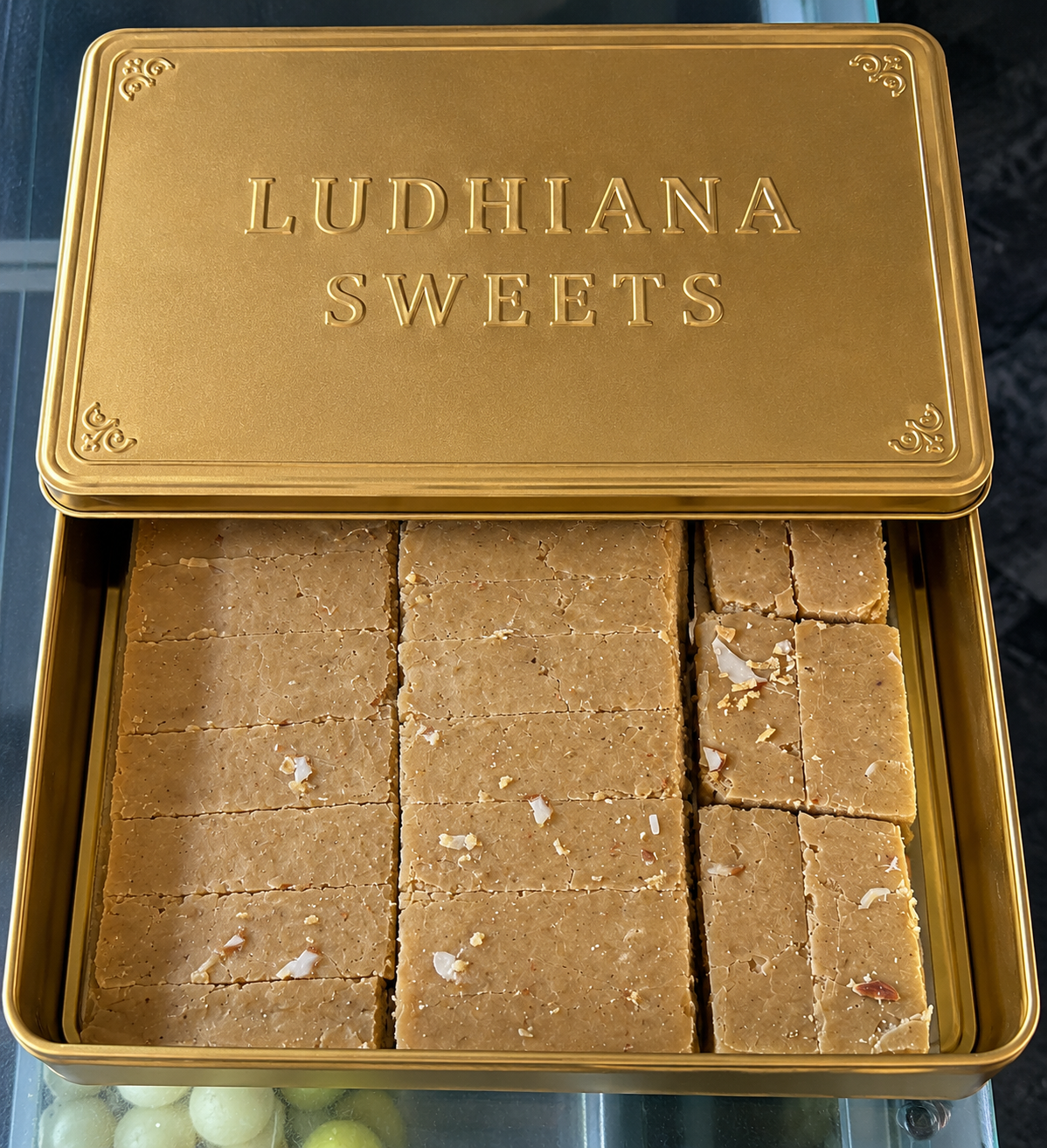 Ludhiana Special Barfi garnished with almonds alongwith fragnance of cardamom